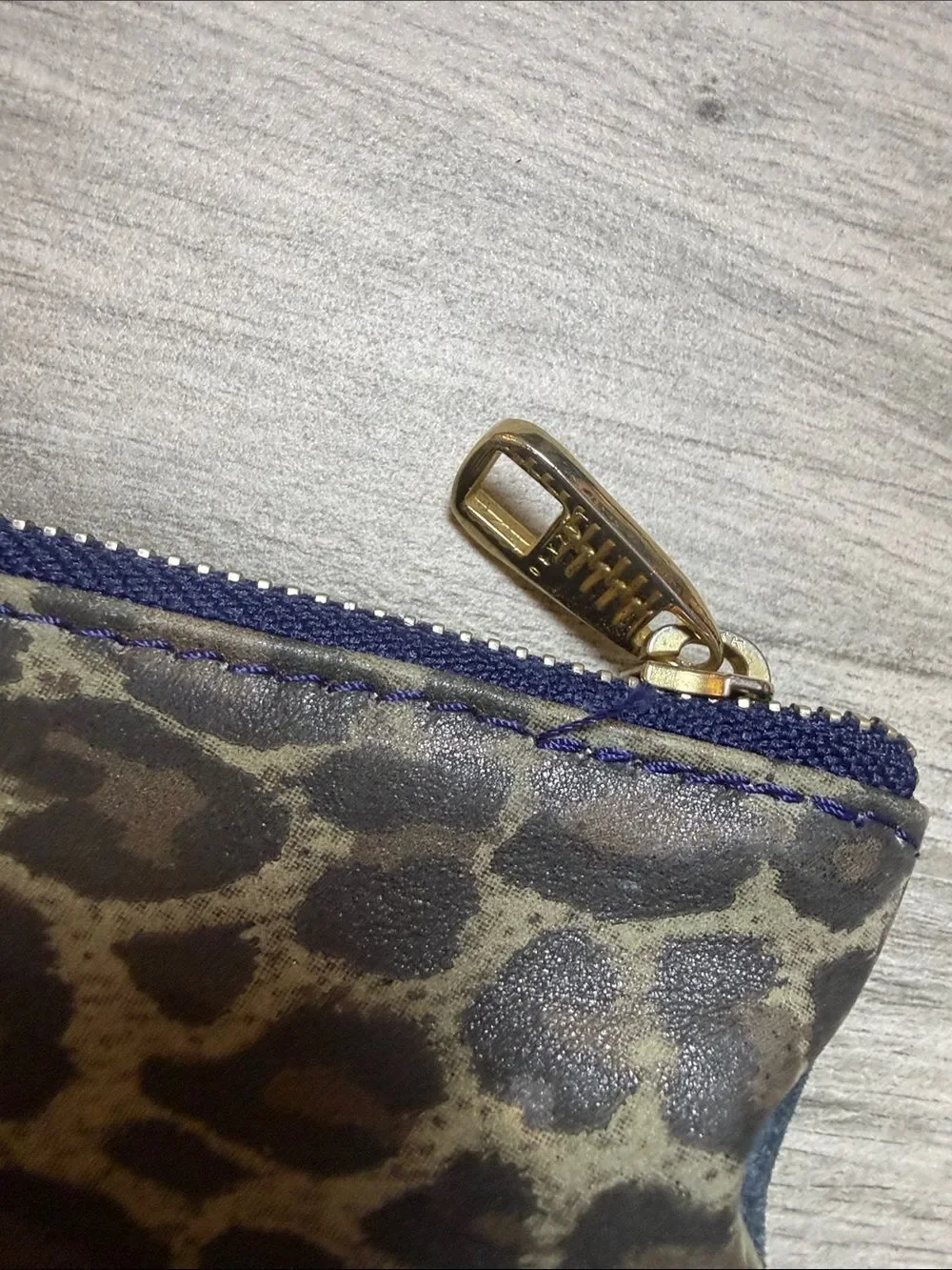 Navy Lazaro Suede Zip Pouch with Gold Hare Emblem